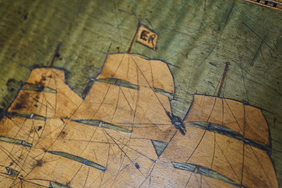 A Victorian writing slope, painted with a panel of a ship in full sail. 39cm wide x 17 cm high. Condition - top cracked